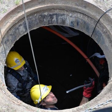 Workers in manhole