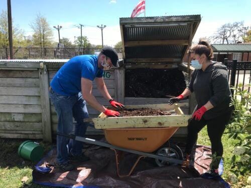 Volunteers sifting finished compost on volunteer day. Credit: Institute for Local Self-Reliance