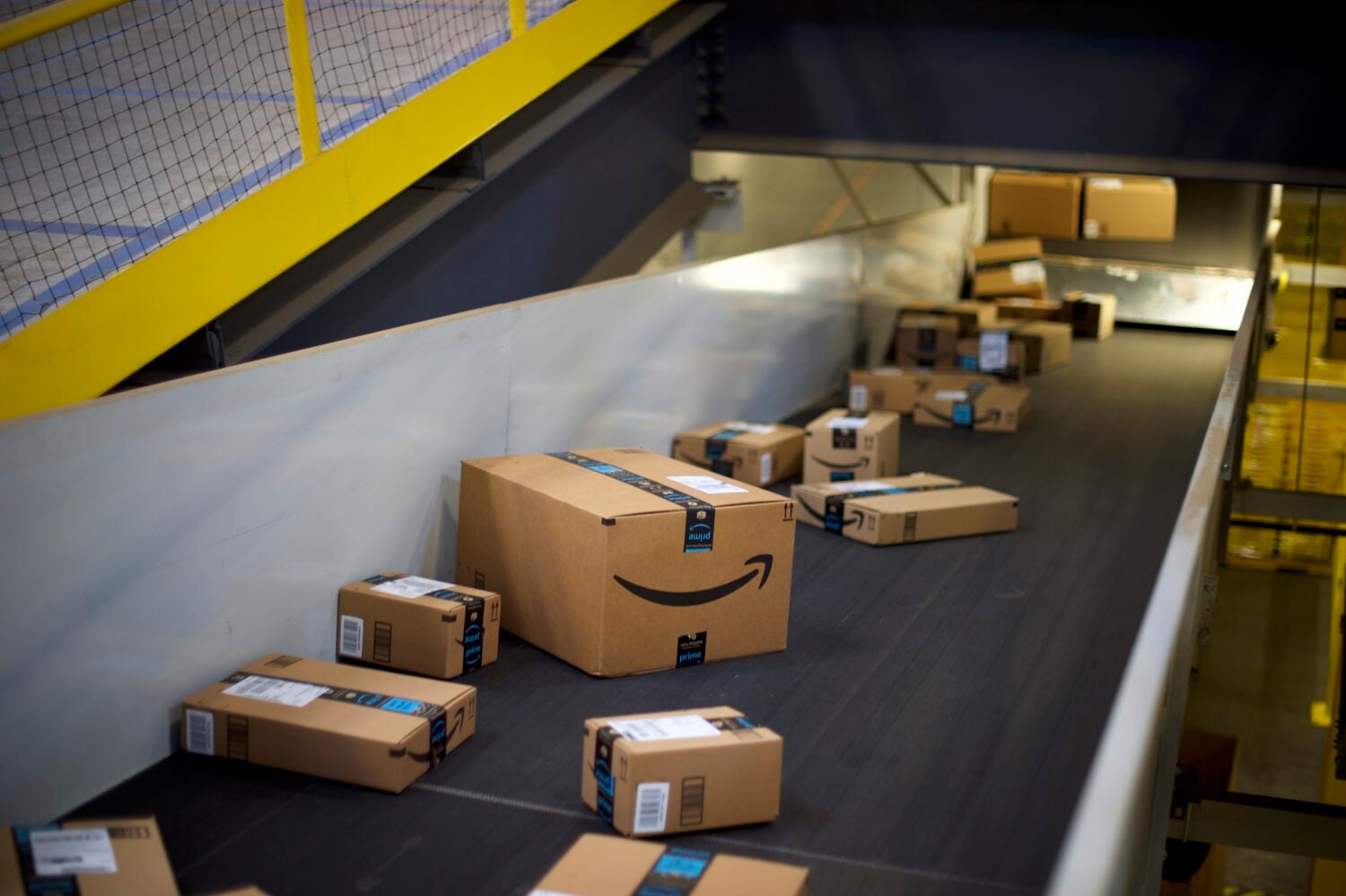 Amazon boxes on a conveyor belt in a distribution center