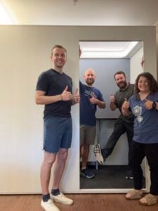 local officials gives thumbs standing at entrance of new privacy pod