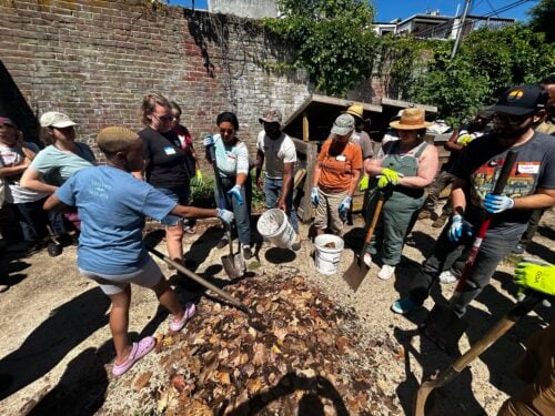 Volunteers mixing organics. Credit: Philadelphia Parks and Recreation